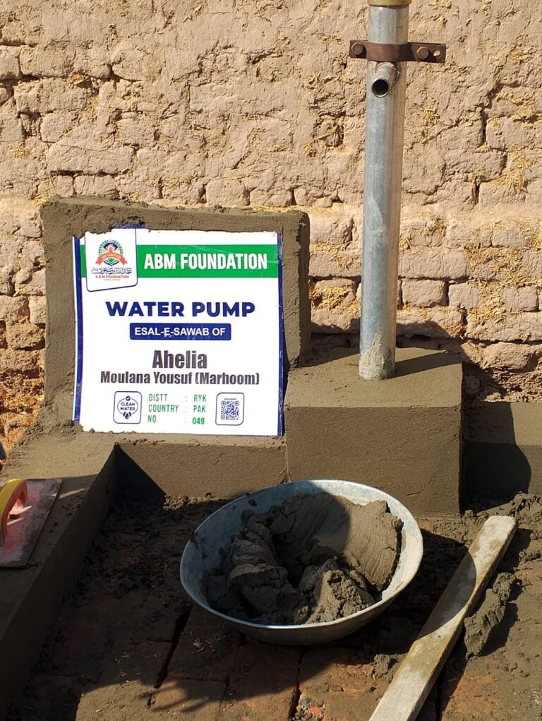 Clean water hand pump installation in a rural community