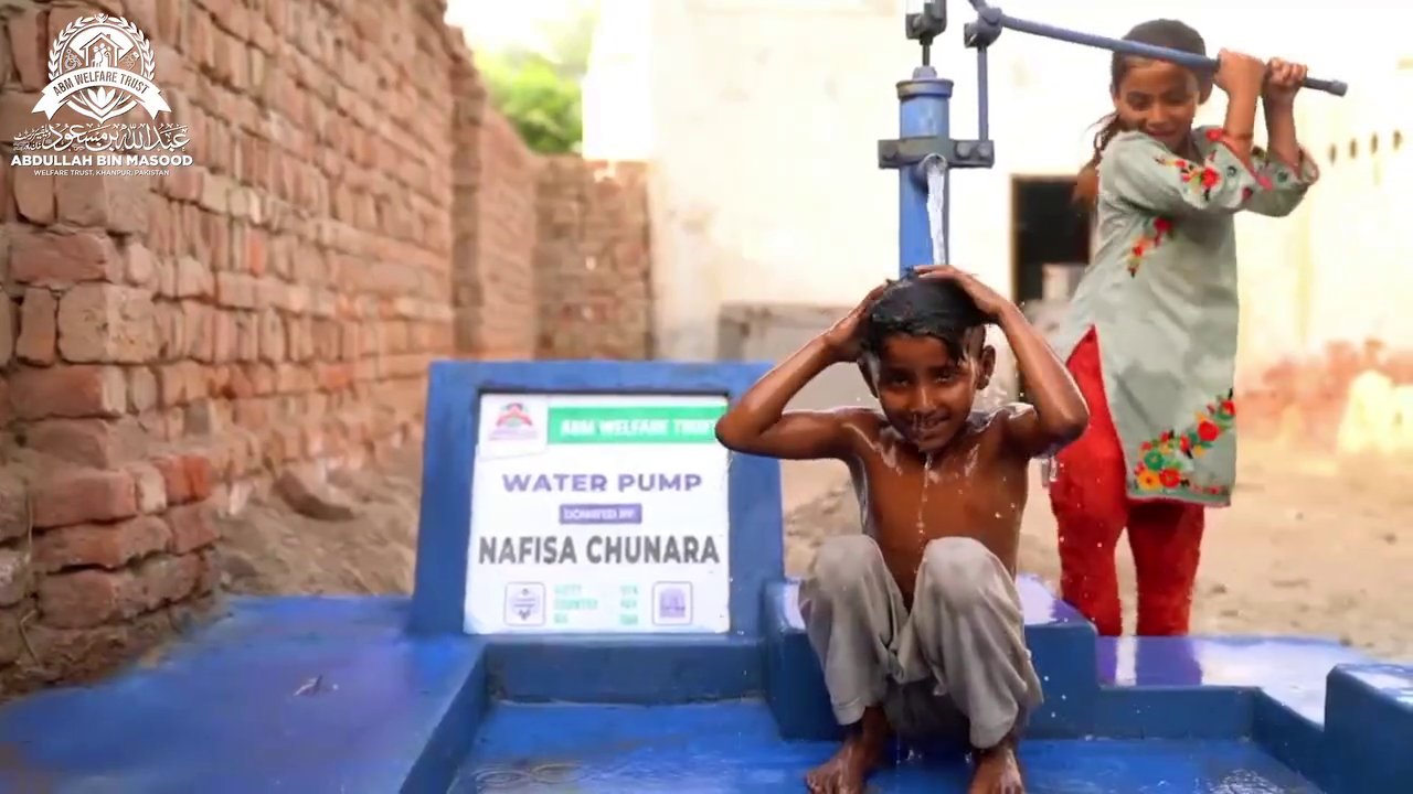 Children bathing at donor funded water pump
