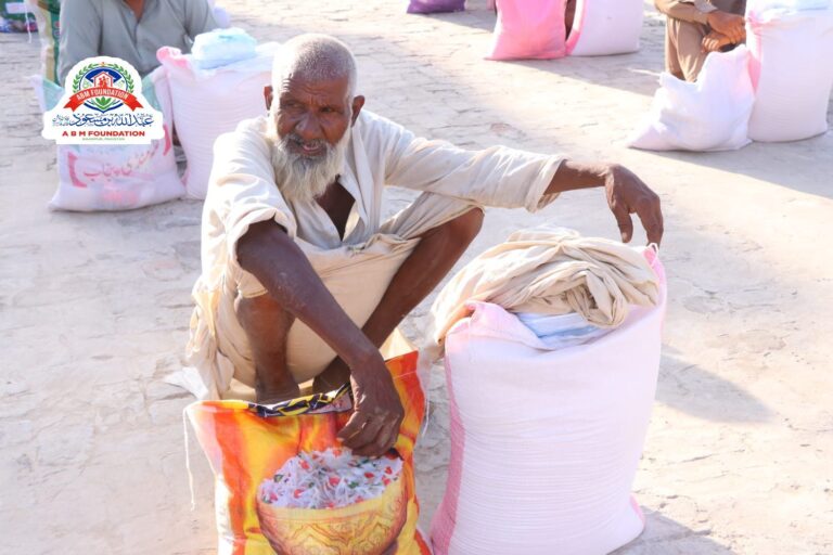 Elderly man with flood relief ration supplies