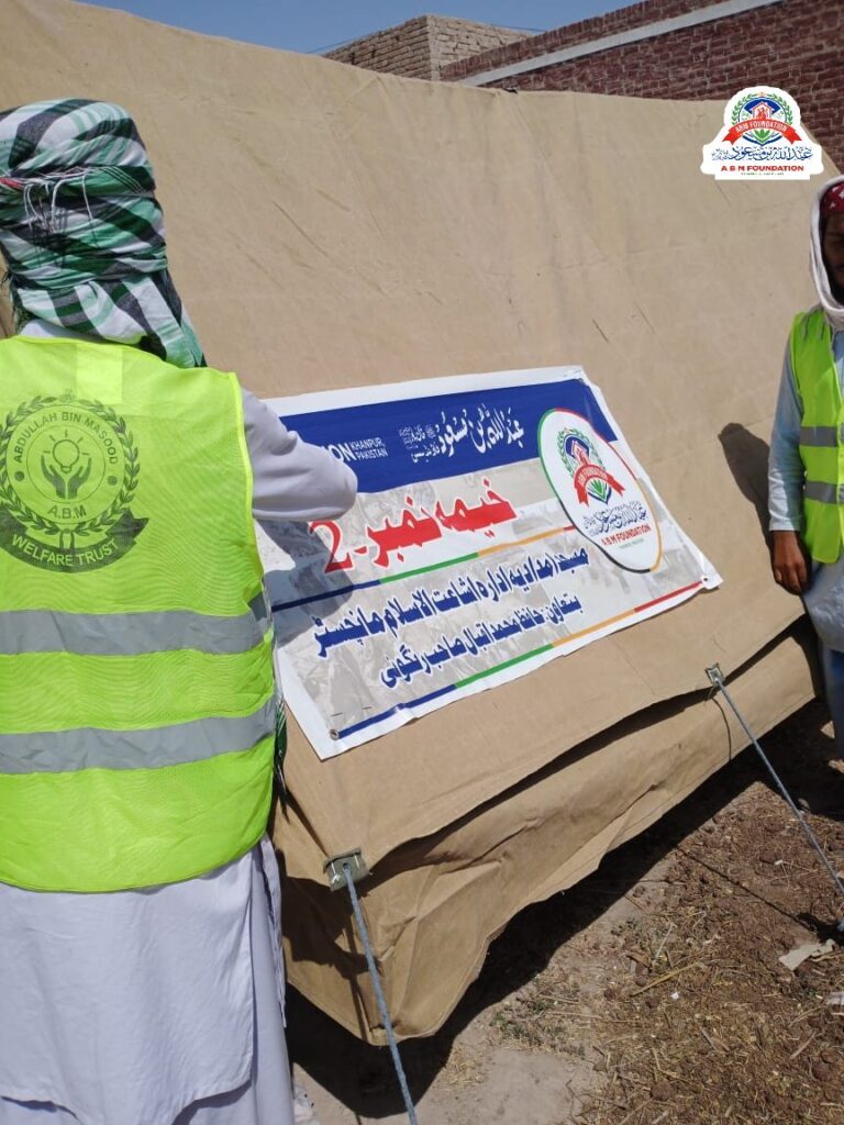 Flood relief emergency shelter tent and volunteer