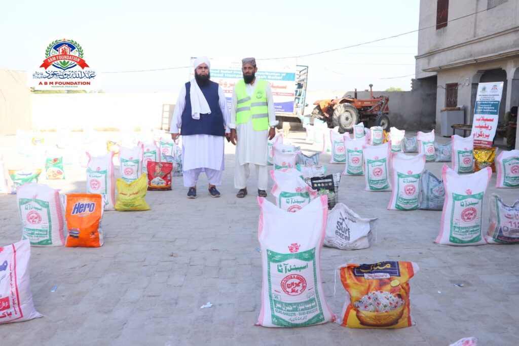 Volunteers with food ration packages for families