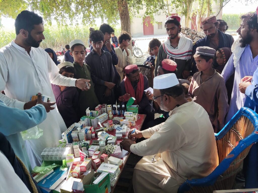 Flood relief medical camp doctor dispensing medicines