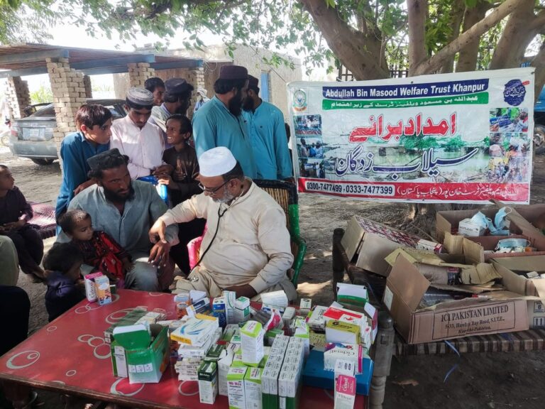 Flood relief medical camp doctor examining child