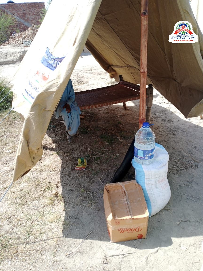 Flood relief tent with drinking water and food box