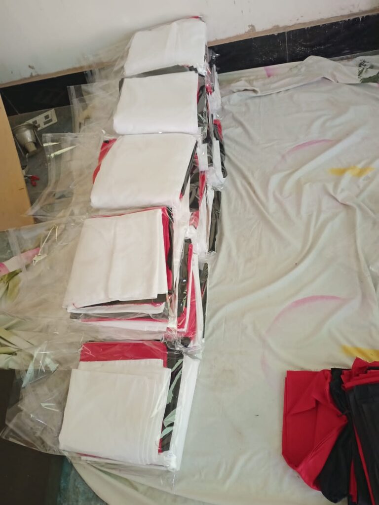Folded garments prepared for charity distribution