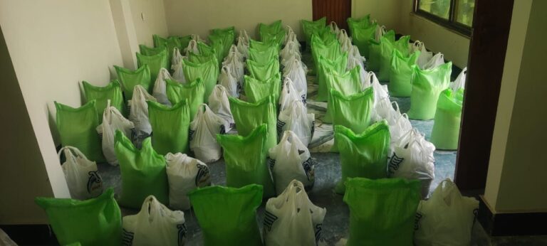 Green food ration bags organized for distribution