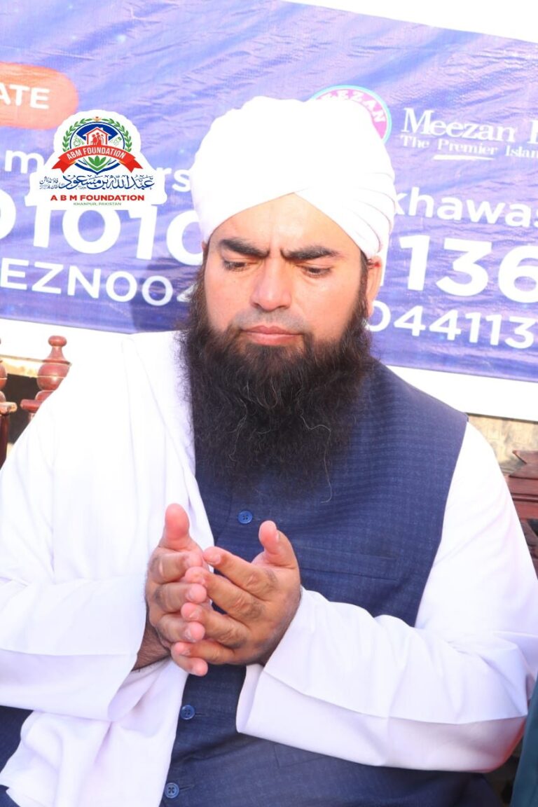 Religious scholar making dua during ration distribution