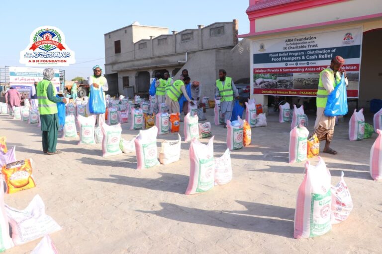 Volunteers arranging flood relief food ration bags