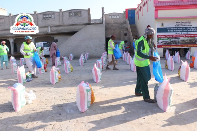 Volunteers distributing flood relief food ration bags