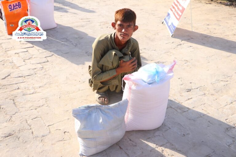 Young man receiving flood relief food ration